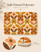 Soft flannel polyester indoor runner mat with an orange and yellow leaf design, displaying close-up circles of the plush surface and 0.39-inch mat edge.