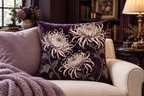 Spider Chrysanthemum Botanical Printed Velvet Pillow Cover, lifestyle view 2: A prominent single pillow on a sofa beside one plain solid-colored cushion; medium interior composition, product fills at least 40 percent of frame.