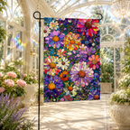 Stained glass floral garden flag displayed inside a bright conservatory with potted roses, white flowers, and rainbow sunlight.