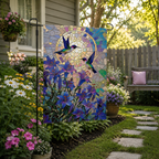 Stained glass hummingbird garden flag displayed in a sunny backyard garden
