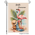 Sunlit flamingo getaway garden flag with tropical leaves and beach accents.