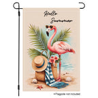 Sunlit flamingo getaway garden flag with tropical leaves and beach accents.