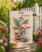 Sunlit flamingo getaway garden flag displayed beside a white picket fence.