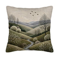 A square throw pillow cover isolated on a white background, featuring a highly detailed faux-embroidery print of a serene countryside valley, winding river, and white blossoming trees under a soft grey sky with flying birds.