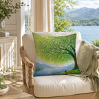An oil painting tree and lake throw pillow cover arranged on a white armchair in a living room.