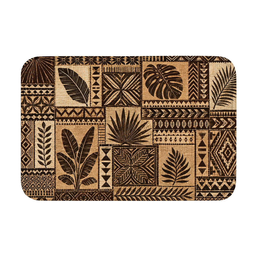 A rectangular doormat featuring a brown and beige tropical botanical leaf patchwork pattern on a solid white background.