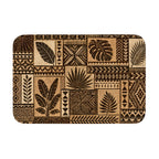 A rectangular doormat featuring a brown and beige tropical botanical leaf patchwork pattern on a solid white background.