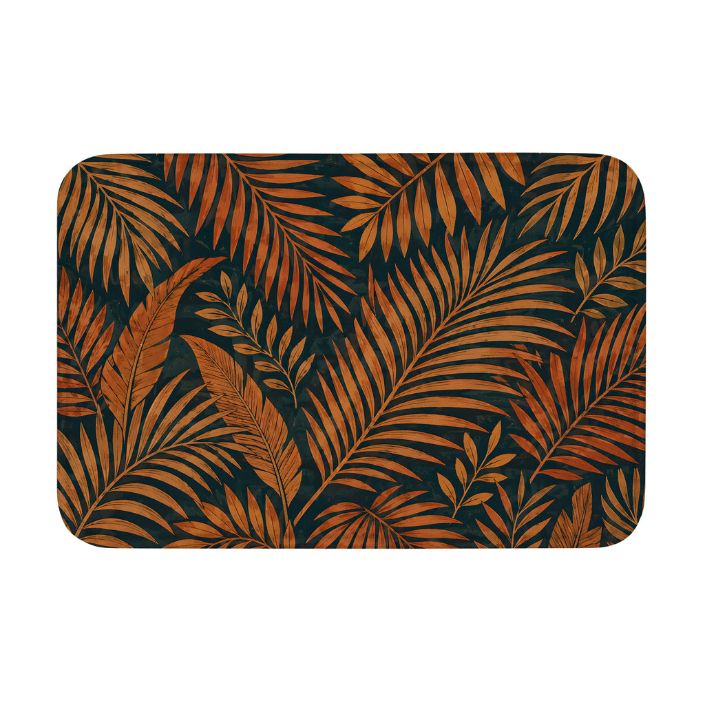 Tropical palm leaves doormat featuring amber and brown botanical fronds pattern on a dark background.