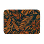 Tropical palm leaves doormat featuring amber and brown botanical fronds pattern on a dark background.