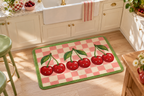 Vampire Cherry Check Printed Floor Mat, lifestyle view 2: One mat on the kitchen floor in front of a sink or coffee station, full printed surface readable, no furniture hiding the design.