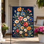 Wildflower bouquet garden flag displayed on a bright farmhouse porch