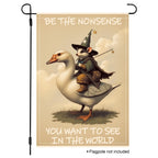 Whimsical wizard possum riding a goose garden flag with playful quote.